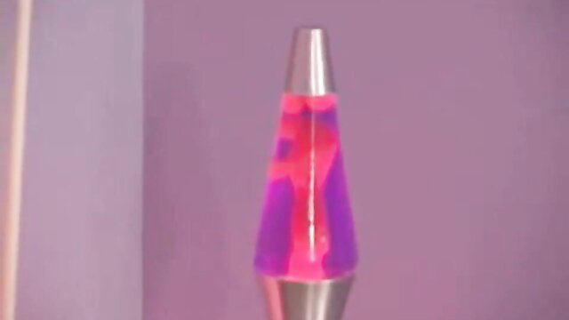Purple lava lamp glowing in dim purple room adult video thumbnail
