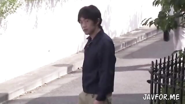 Handsome young Asian man in dark jacket walking outdoors JAV thumbnail