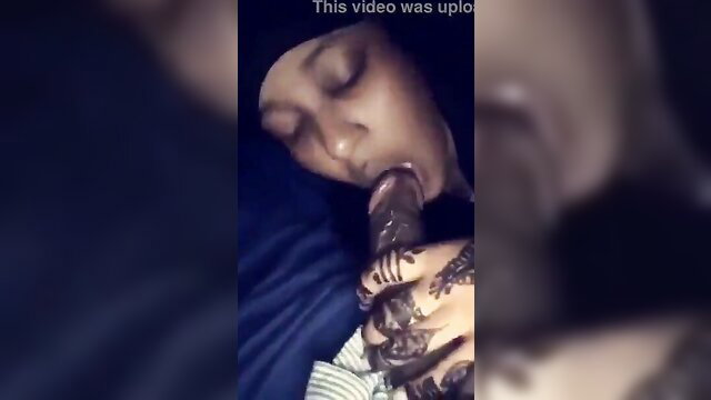 Ebony woman in hijab sucking thick cock with mehndi hands