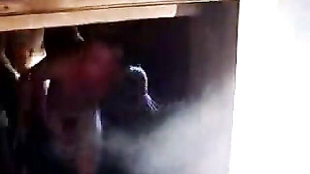 Blurry Russian nudist women in steamy outdoor embrace