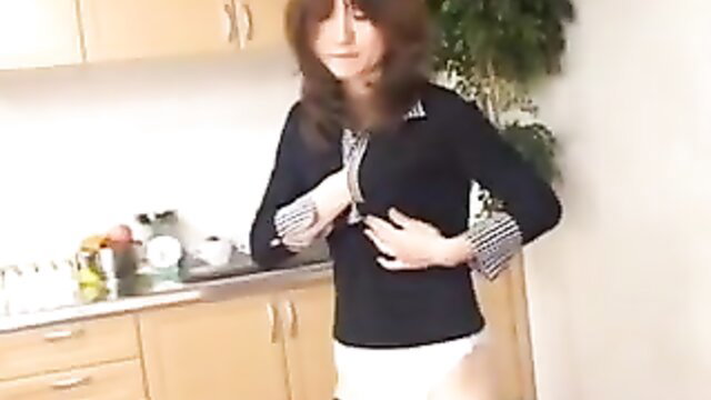 Asian beauty in black blouse and white skirt groping tits in kitchen
