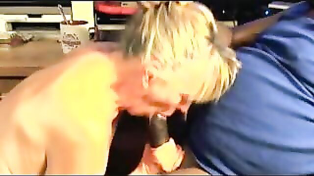 Blonde granny eagerly sucking big black cock in hot blowjob