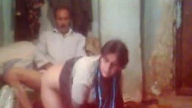 Arab rookie Isadora nude on bed, legs spread, man watching from behind