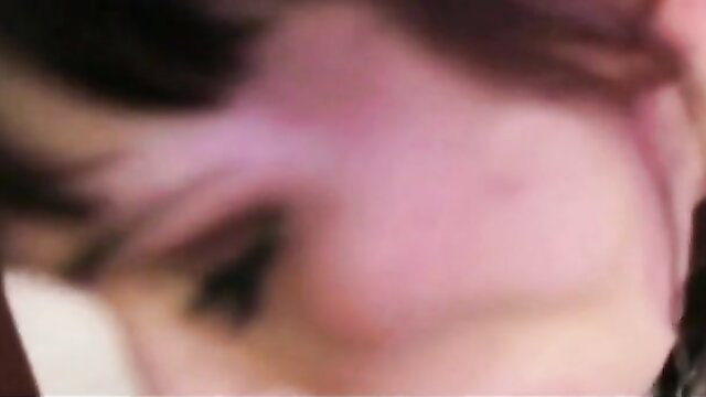 Closeup of cute girl's flushed face with pink hair in steamy fun