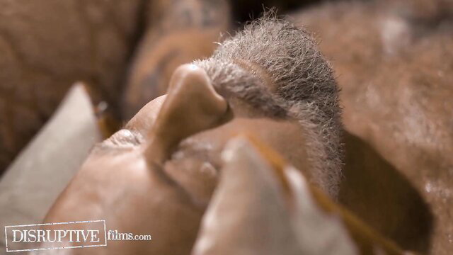 Closeup of lonely older man's face with gray beard in adult video