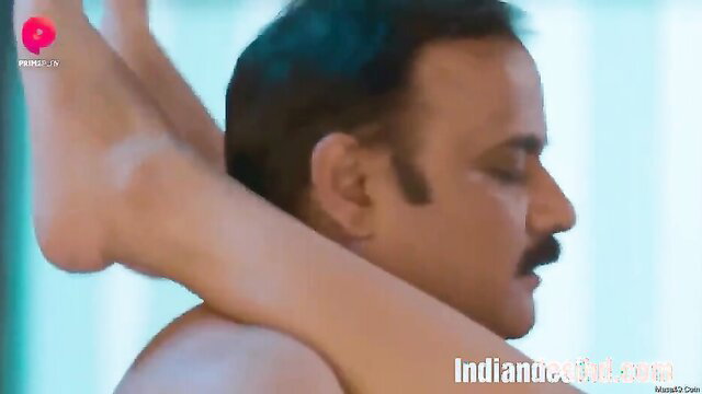 Indian aunty footjob on man's face in steamy web series scene