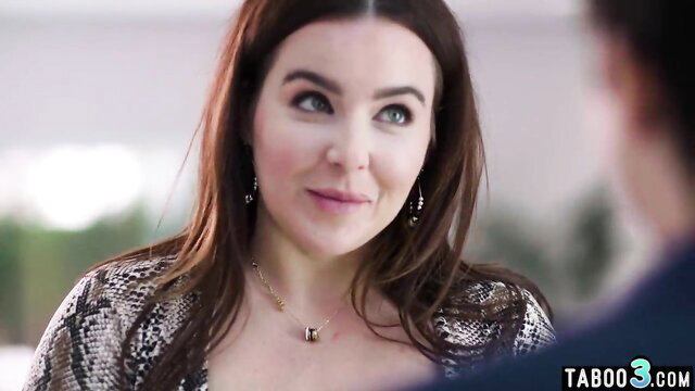 Natasha Nice big boobed BBW MILF in snakeskin top smiles seductively