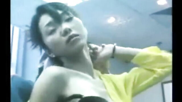Asian woman with neck held, topless in yellow top, seductive pose