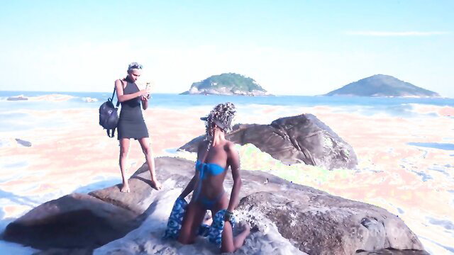 Mih Ninfetinha bikini on rocks at beach, friend snapping pic, public tease