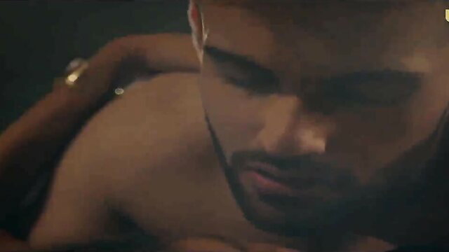 Hot Indian man with beard kissed on neck by woman's hand in steamy Ullu scene