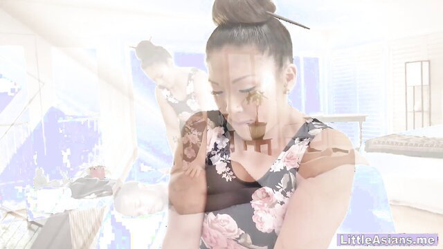 Asian teen in floral dress poses seductively before riding big black cock