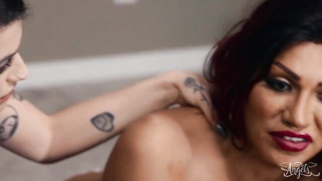 Tattooed brunette pleasures horny shemales in hot threesome