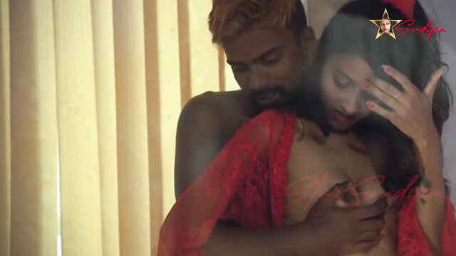 Sudipa in red lingerie embraced by muscular Indian lover