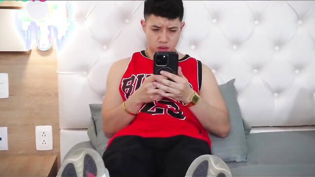 Asian twink in Bulls tank top and shorts seduces stepbro on bed