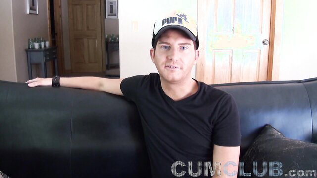 Hot guy in Puma hat on couch, huge cum swallowing facial preview