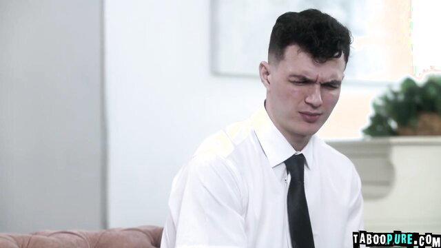 Handsome suited man grimacing in tense talk about fucking Mrs. Carson