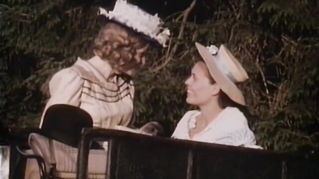 Patricia Rhomberg in vintage lesbian carriage scene with hats