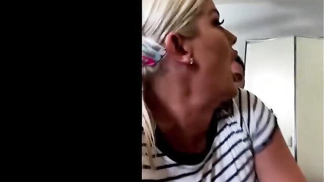 Busty blonde Julie Cash topless with striped top, big tits profile view