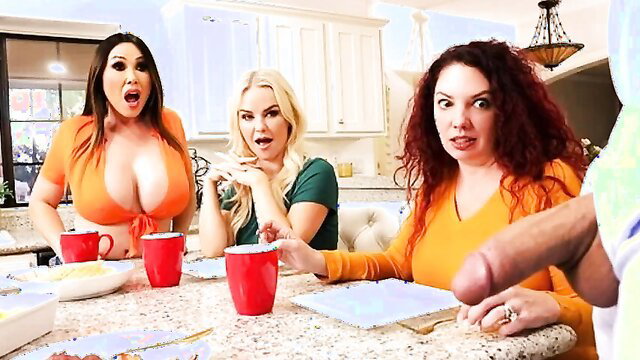 Three busty babes in kitchen eyeing huge cock for messy facial threesome