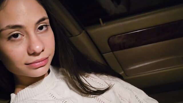 Pretty Asian girl in car with sultry gaze, perfect for filthy blowbang fantasies