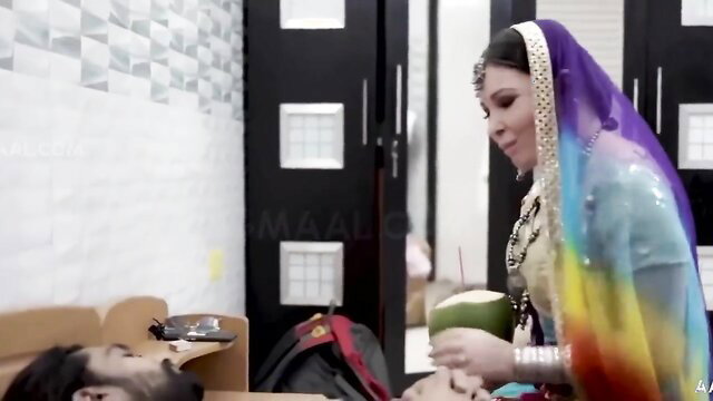 Big ass Indian babe in colorful saree holds coconut over man in hot short film