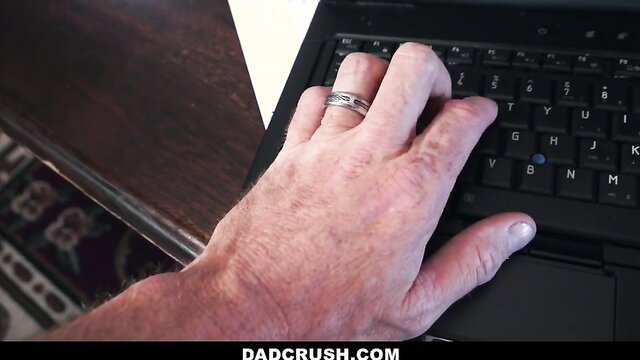 Hairy older man's hand typing on laptop in Dad Crush video