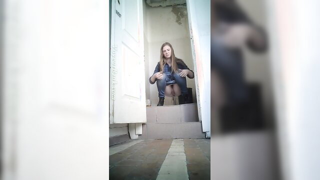 Blonde babe squats in toilet on voyeur cam, ready to pee