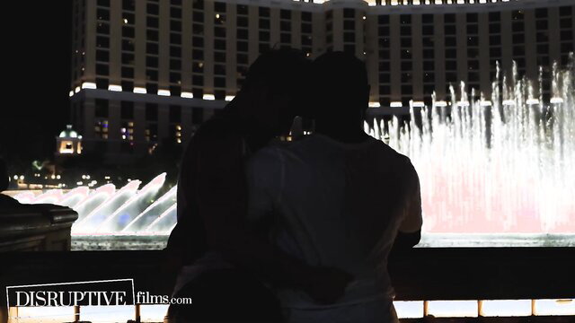 Silhouette couple embracing at Vegas fountain, Sin City bareback anal tease