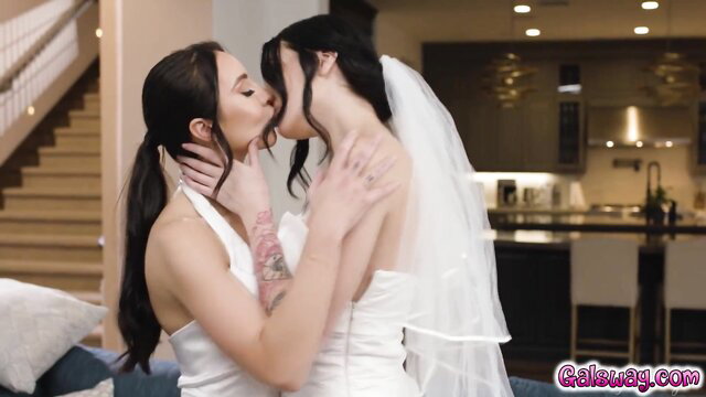 Annie Charlotte lesbian wedding kiss with bride in white dress