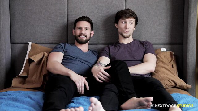 Two hot muscular guys bare on bed sharing raw anal foreplay