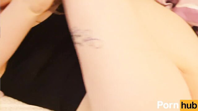 Dani Daniels tattooed arm closeup, nude skin in sexy lingerie