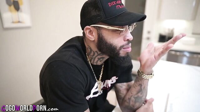 Gogo Fukme with tattooed black man in DICK hat, steamy threesome vibe