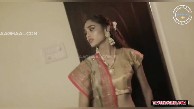 Indian beauty in gold saree blouse, seductive gaze, hot desi tease