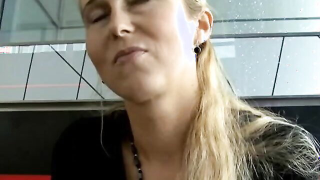 Naughty blonde MILF closeup face in car, eyes closed, wet lips parted