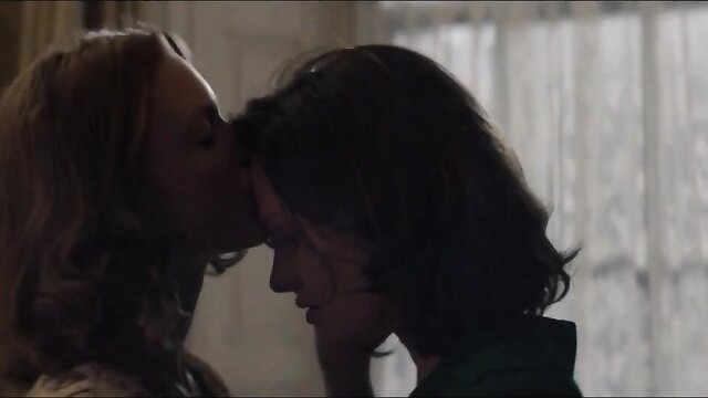 Blonde milf kissing brunette teen in intimate silhouette embrace