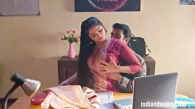 Asian wife in pink dress getting hugged from behind by a man