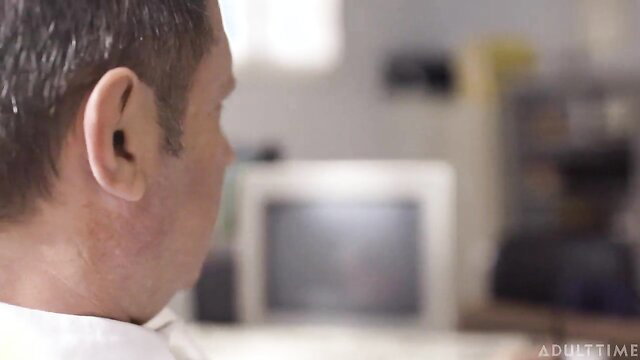 Man with gray hair views group scene thumbnail