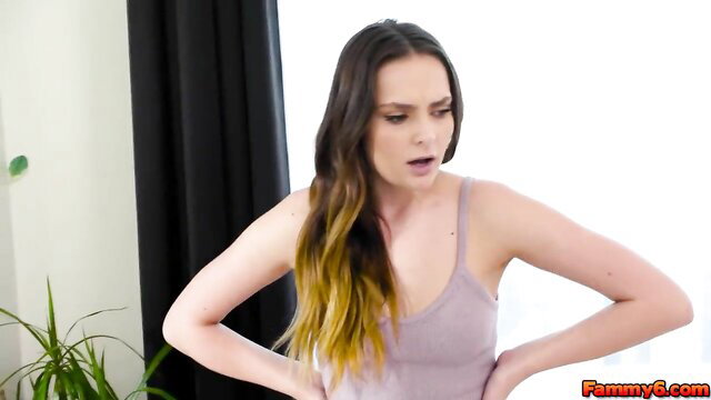 Aften Opal shocked expression in tank top, long wavy brown blonde hair