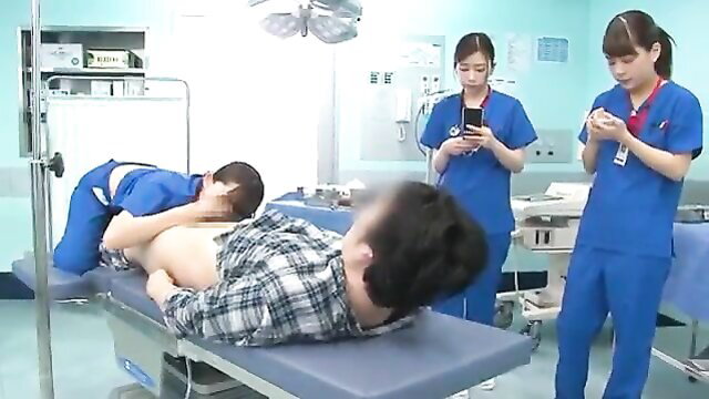 JAV nurses in blue uniforms examine patient on exam table