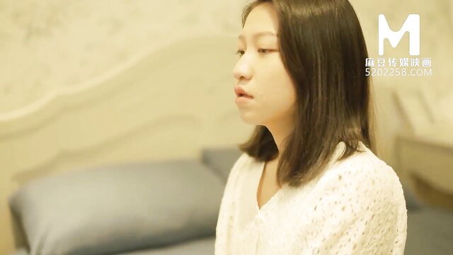 Shen Na Na closeup in sheer white top, seductive gaze, Perv Daddy Club trailer