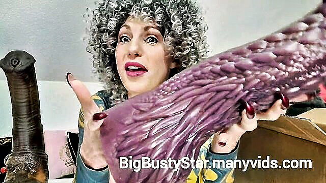 Big Busty Star unboxes huge purple dragon dildo from Mr. Hankey's Toys