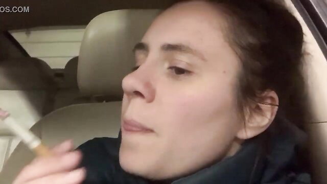 Amateur brunette woman smoking cigarette in car, casual storytime thumbnail