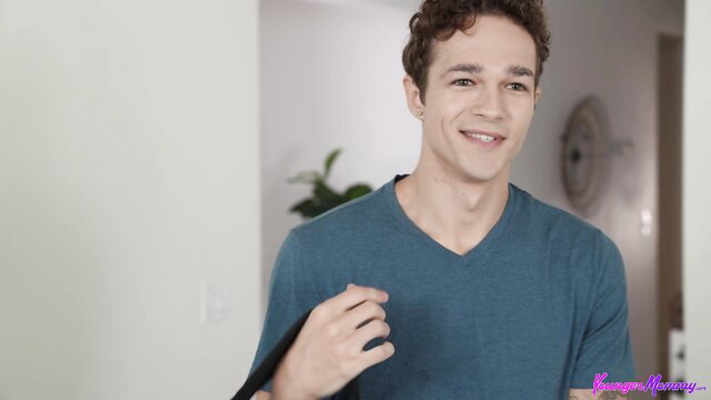 Jayden Marcos smiling in teal V-neck shirt, POV adult video thumbnail