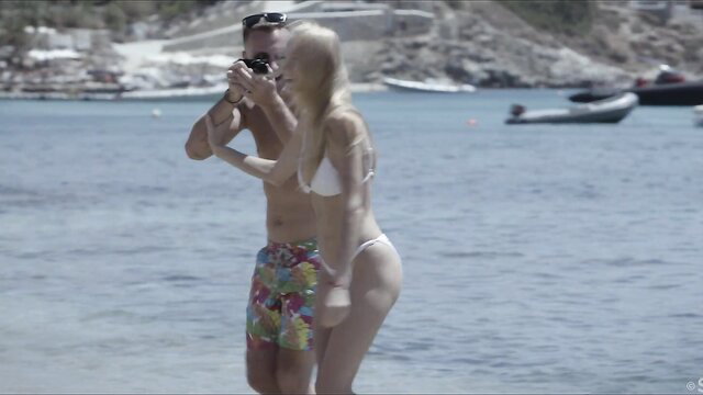 Blonde babe Ariel Piper Fawn poses in skimpy white bikini at beach with Nick Ross