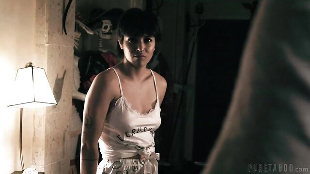 Brooklyn Gray in skimpy tank top, tattooed, intense stare in Adult Time scene