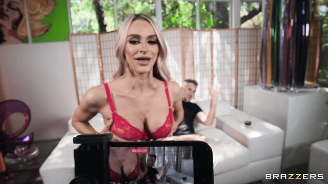 Emma Hix in red lingerie waves in steamy Brazzers scene with Keiran Lee