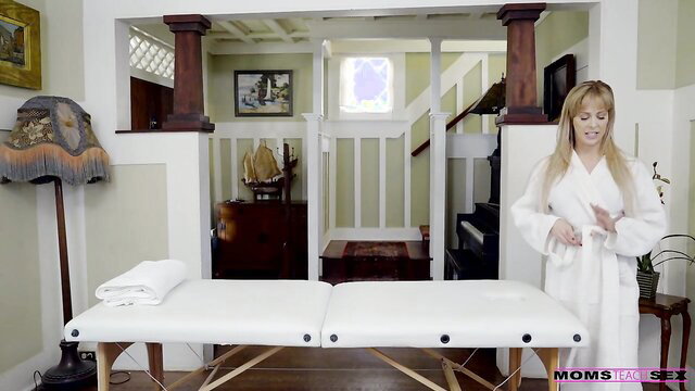 Cherie DeVille blonde MILF in robe at massage table POV