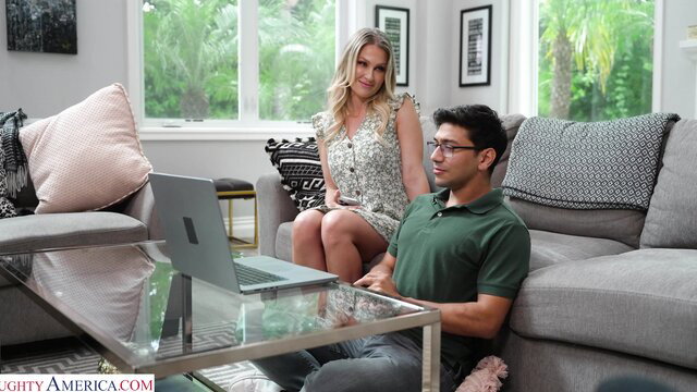 Blonde MILF Andi Avalon in dress with son's friend on couch