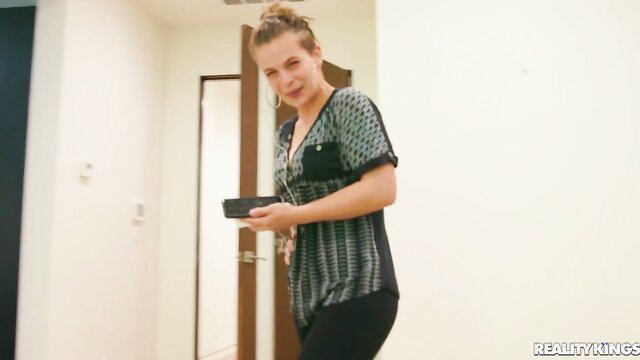 Autumn Falls in sexy black top and tight pants poses playfully