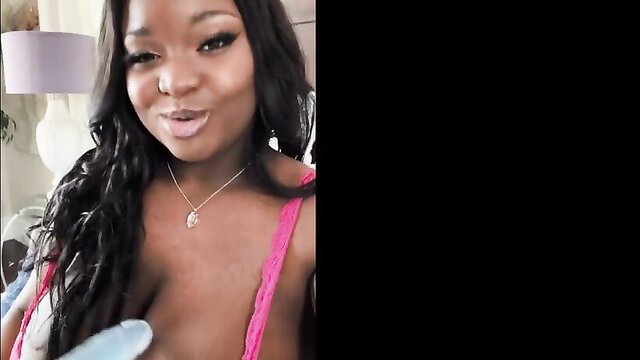 Lily Starfire in pink lingerie holds vibrator, big tits tease